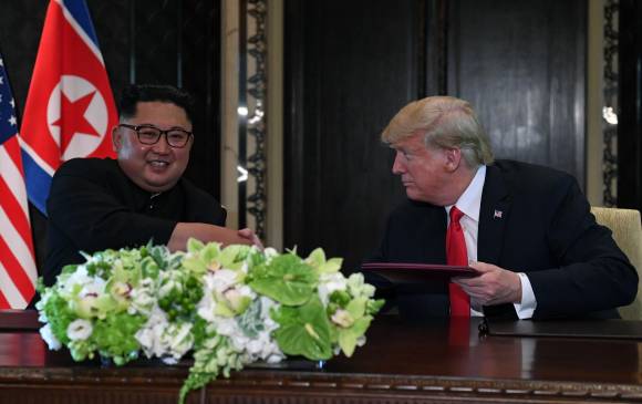 Kim Jong-un y Donald Trump. AFP