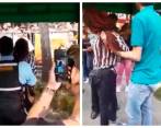 Momentos en que era retirada la persona señalada de intentar arrebatar el bebé. Foto: Capturas de video. 