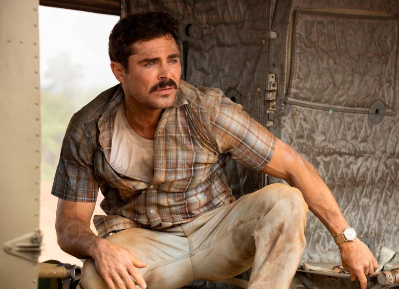 Zac Efron como Chickie Donohue, el hombre que sacrifica todo por llevarle cerveza a sus amigos en la guerra. FOTO cortesía apple tv+