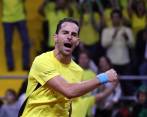 Santiago Giraldo y la celebración del primer triunfo de Colombia sobre Suecia en la serie de Copa Davis. FOTO EFE