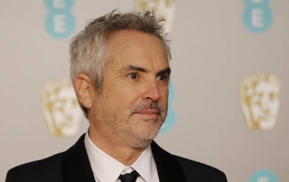 El director mexicano, Alfonso Cuarón, en la alfombra roja de los Bafta 2019, en el Royal Albert Hall de Londres. FOTO: AFP